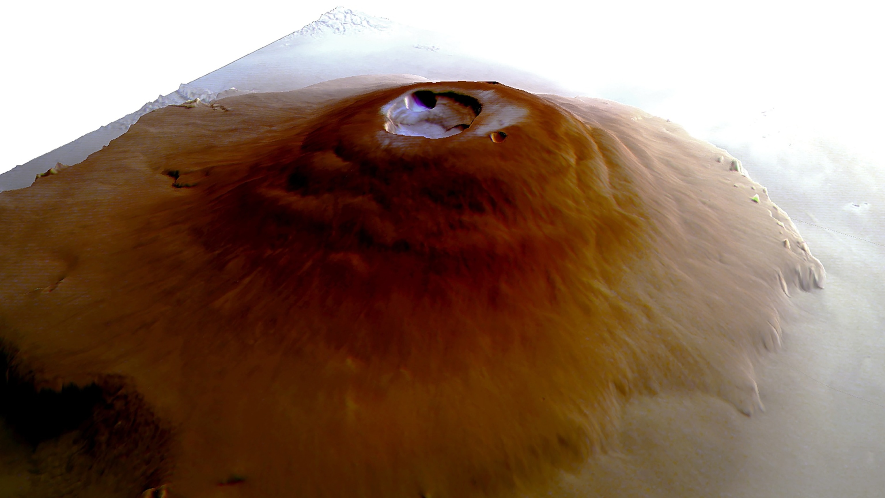 PHOTO: This simulated oblique perspective view shows Olympus Mons, the tallest volcano not only on Mars, but in the entire solar system.  The volcano has a length of about 600 km.