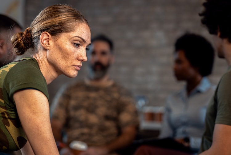 Woman looking off in the distance at a party